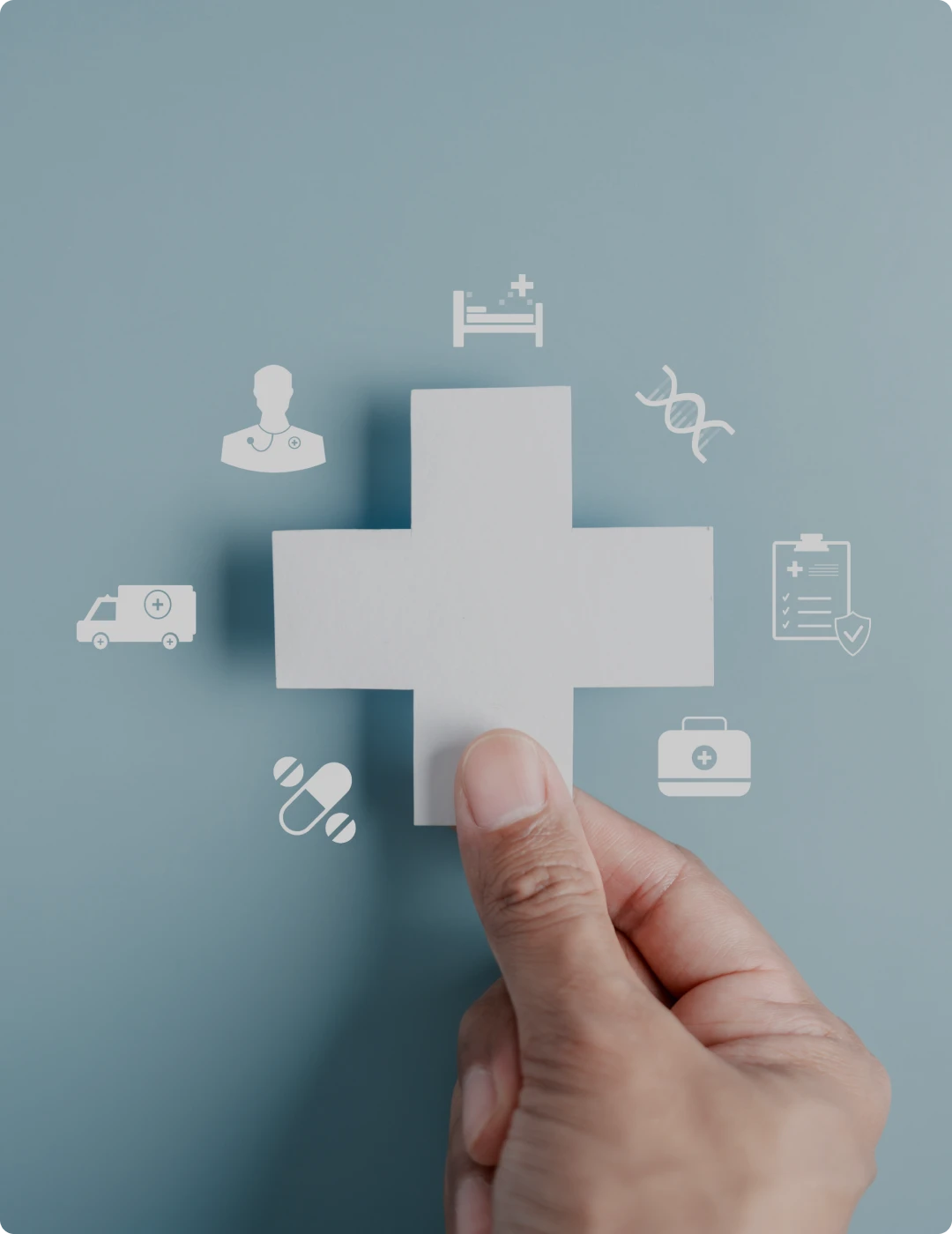 Healthcare symbols surrounding a cross