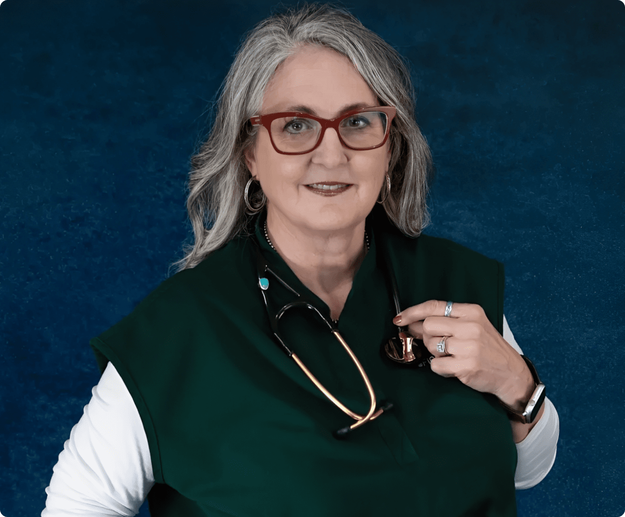 Medical professional with stethoscope and green top
