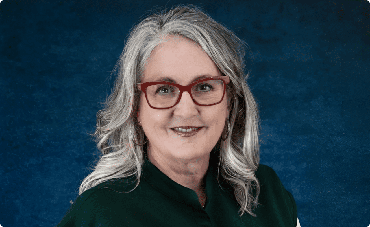 Portrait of smiling woman wearing red glasses